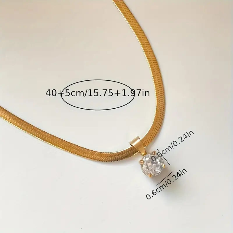 Colar elegante com pingente de strass dourado da Rose & Oliver, joia sofisticada para ocasiões especiais.