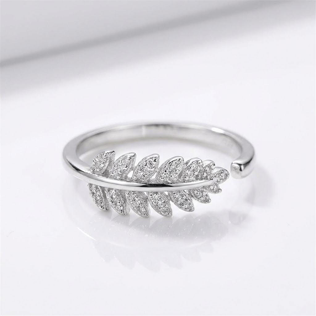 Anel ajustável Rose & Oliver com pena de prata e zirconia brilhante, design delicado e elegante para uso diário.