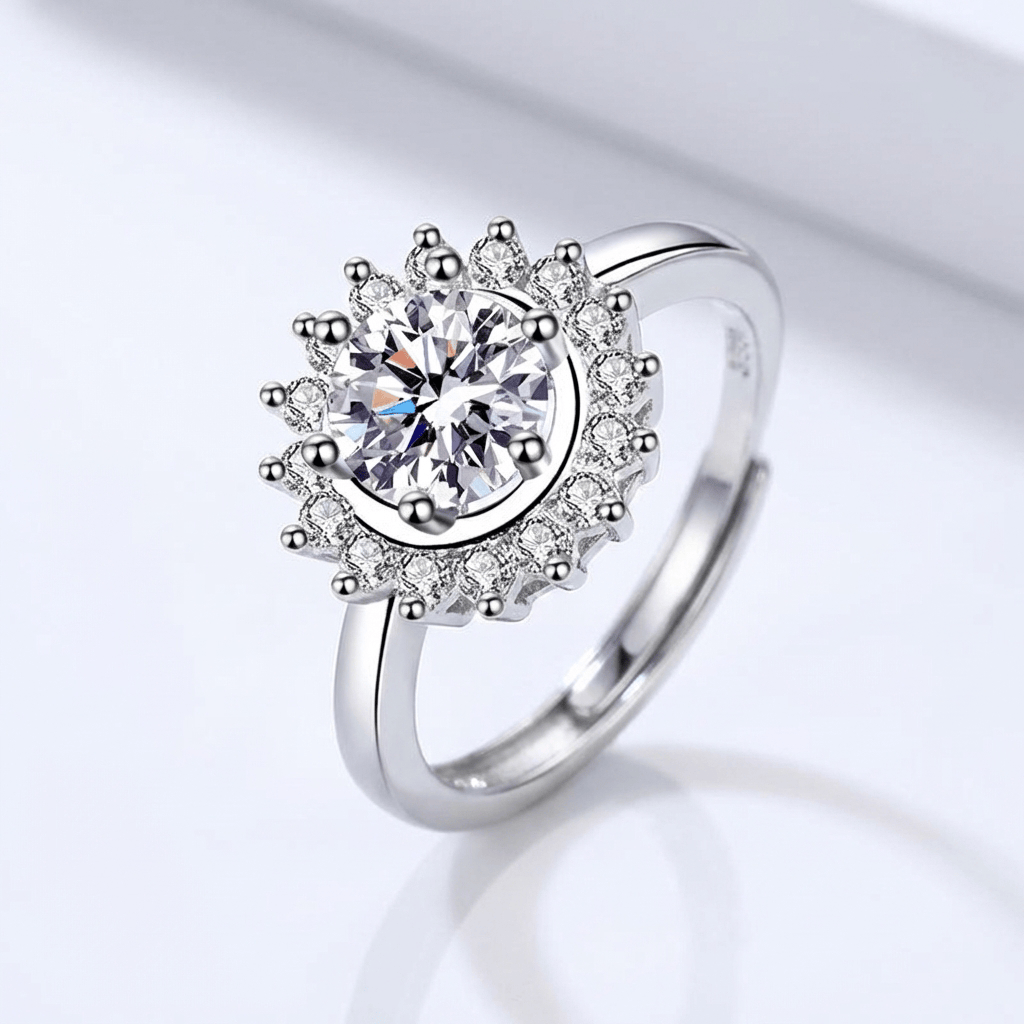 Anel redondo de prata com diamantes estilo sol radiante ajustável, da marca Rose & Oliver, com detalhes brilhantes e acabamento polido.