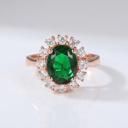 Anel ajustável Rose Gold com diamantes e esmeraldas, design halo elegante da marca Rose & Oliver.
