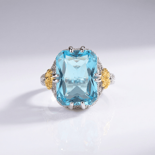 Anel vintage com aquamarine dourado da Rose & Oliver, detalhe elegante e pedra azul em prata envelhecida.