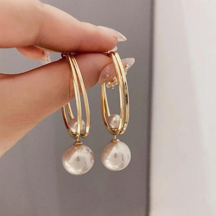 Brincos Vintage Charmming com pérolas da marca Rose & Oliver, detalhes elegantes e acabamento clássico em ouro rosé.