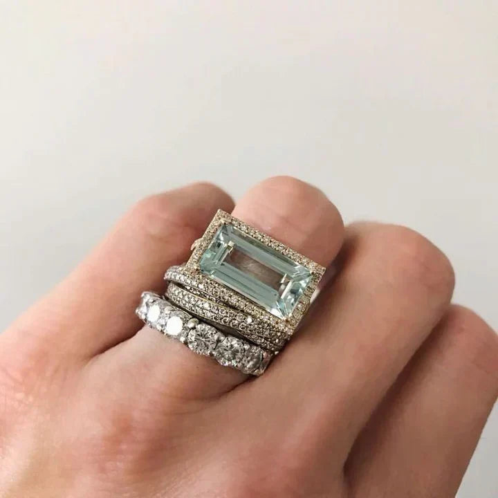 Conjunto de joias vintage com anéis de prata e vidro turquesa, da marca Rose & Oliver, exibindo detalhes elegantes em prata e turquesa