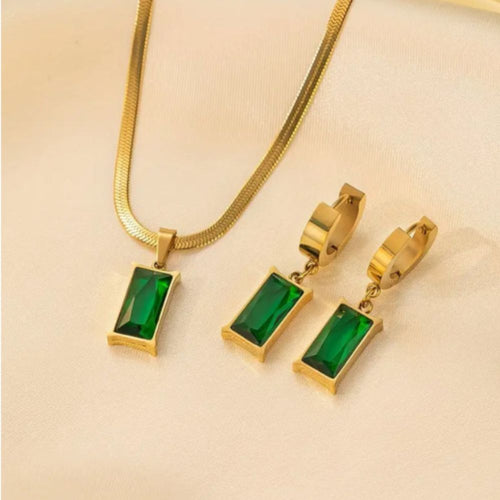 Conjunto de joias Iselotte Verdain da Rose & Oliver com bracelete dourado e detalhes elegantes, exibido na imagem.