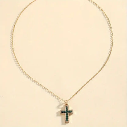 Solene Emerald Cross Pendant Necklace | Gold by Rose & Oliver, detail view